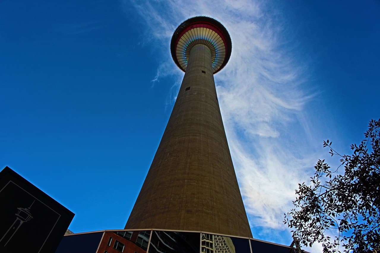 The Calgary Tower seen from street level against a clear blue sky
