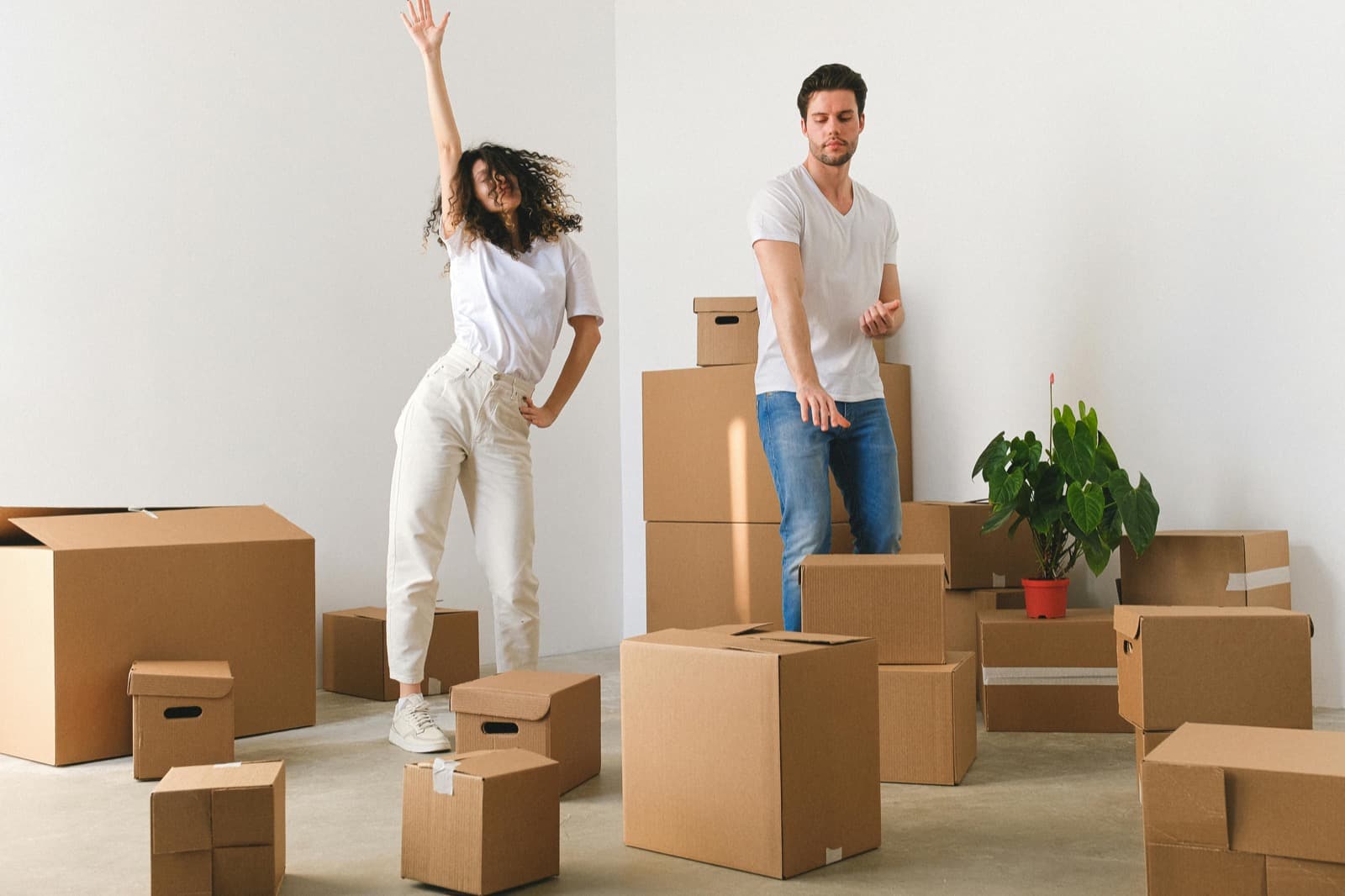 A family moving boxes into a new home
