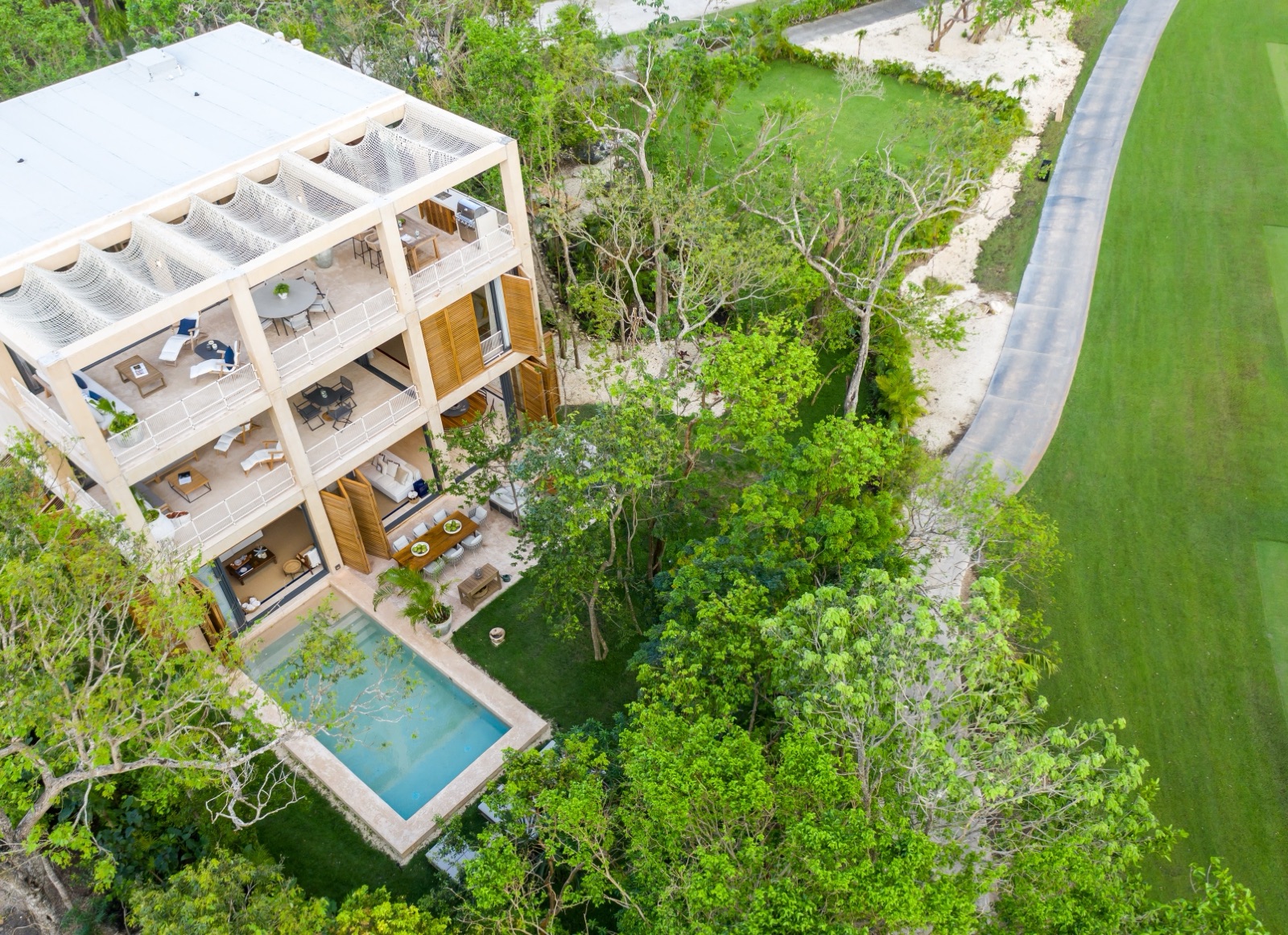 Aerial of a completed Palm Villa with rooftop terraces and private pool on the golf course (verified, 3212x2332)